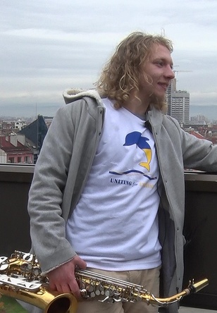 young ukrainian musician with saxophone